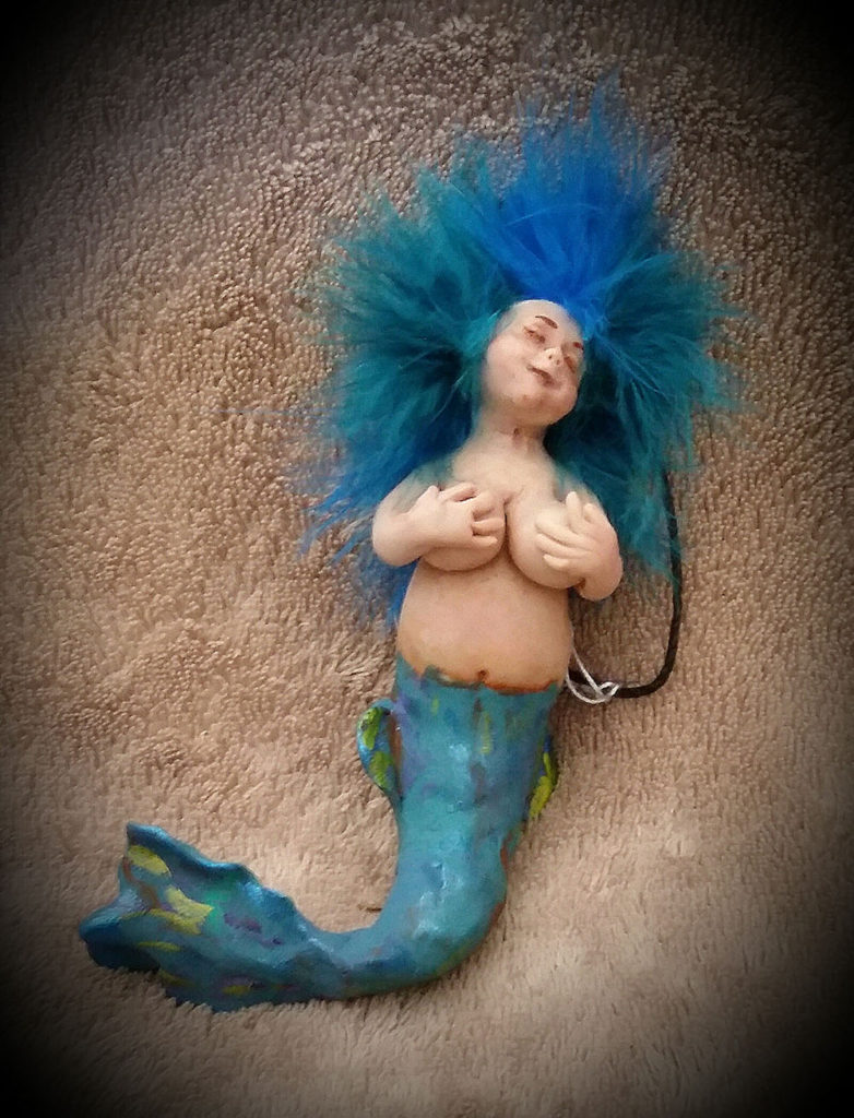 Little blue tailed mermaid created with clay by Tina Parsons