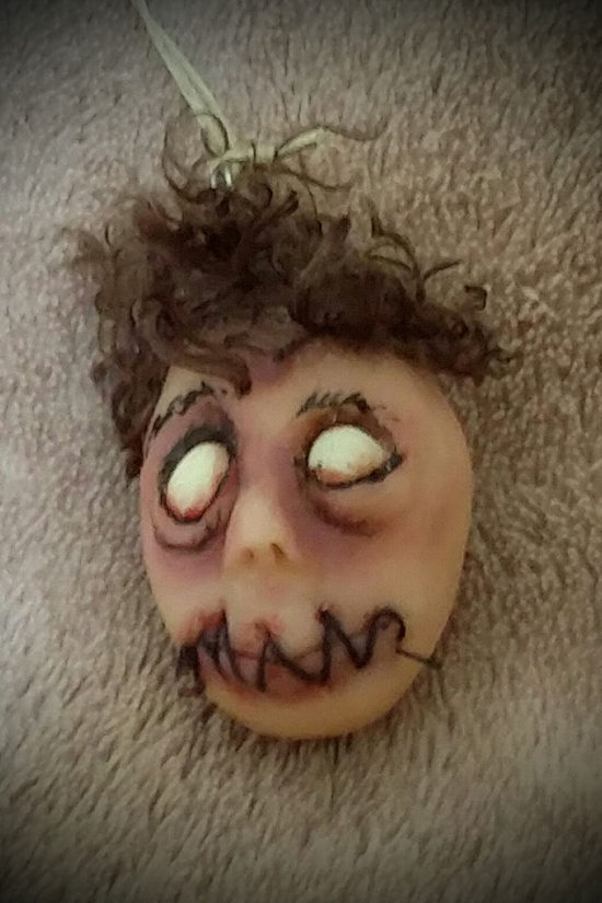 Dead eyed shrunken head by Tina Parsons
