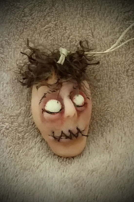 Dead eyed shrunken head by Tina Parsons